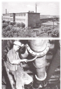 Historisches Bild von Bergbauarbeitern an einer Leitung